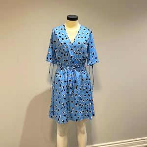 Blue wrap dress with black and white details